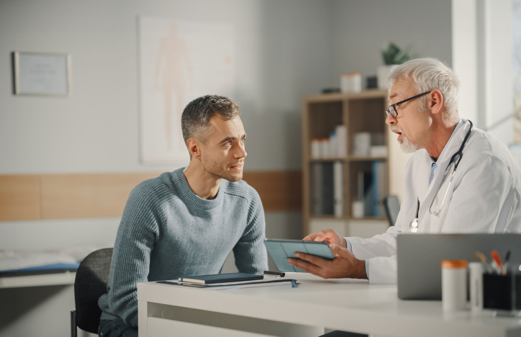 Man and doctor discussing symptoms